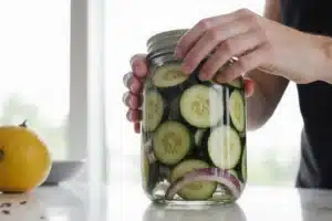Quick Pickle Recipe: Ready in 30 Minutes with Crunchy Flavor 7 Fresh vegetables packed tightly in jar for quick pickle recipe