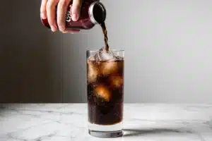 The Best Dirty Dr Pepper Recipe (Easy 3-Ingredient Copycat) 12 dirty dr pepper recipe pouring soda