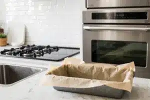 Melt in Your Mouth Garlic Parmesan Chicken Meatloaf: Easy, Healthy, and Family-Approved 4 Loaf pan lined with parchment paper ready for chicken meatloaf