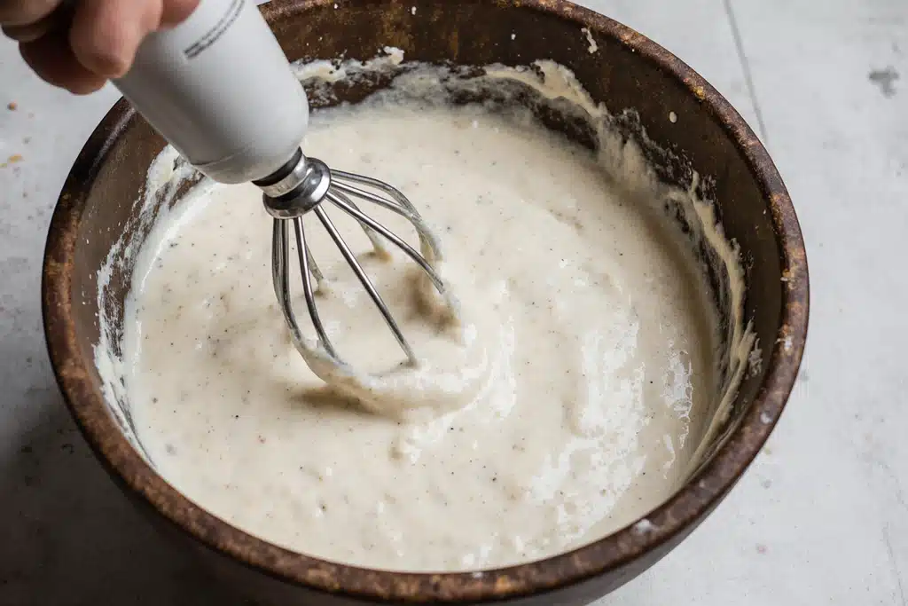 Mixing masa dough for tamales de rajas con queso preparation