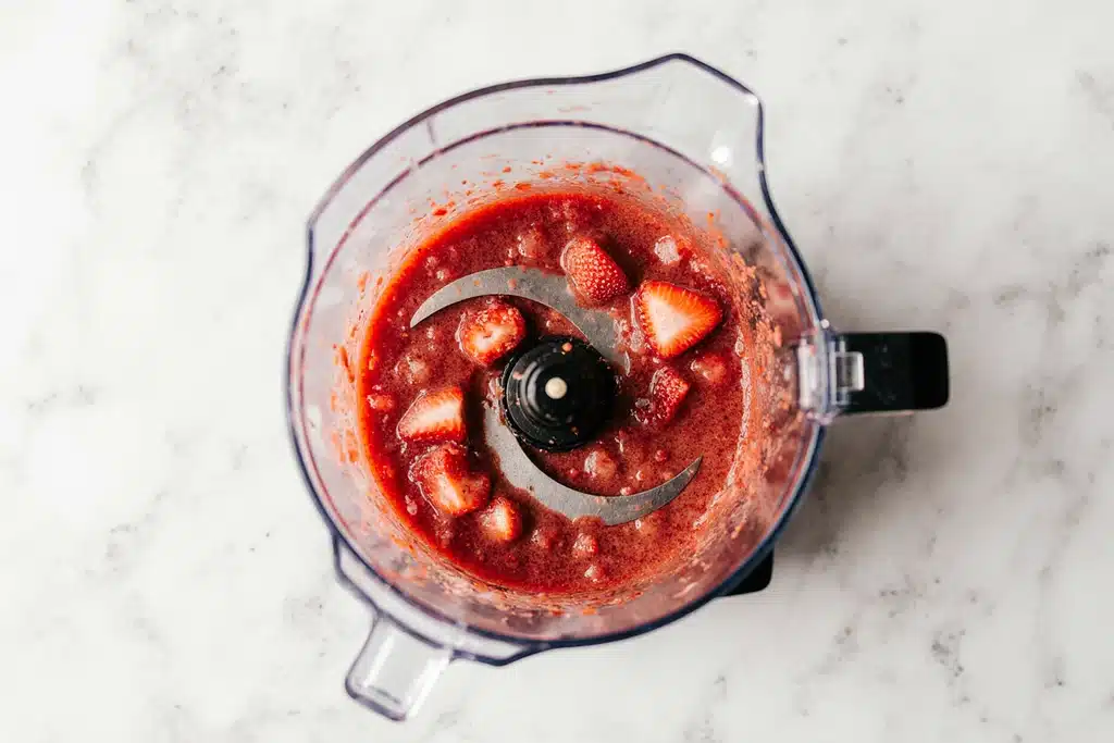 Easy Paula Deen Strawberry Cake Recipe with Creamy Strawberry Frosting 12 Pureed frozen strawberries in a blender for Paula Deen strawberry cake batter and frosting