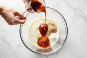 Yum Yum Sauce Recipe – Authentic Japanese Steakhouse Copycat 10 Adding fresh ingredients to a bowl to make yum yum sauce recipe