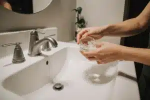 How to Make Effective Homemade Mouthwash Recipe 8 Person swishing homemade mouthwash recipe in mouth for oral care