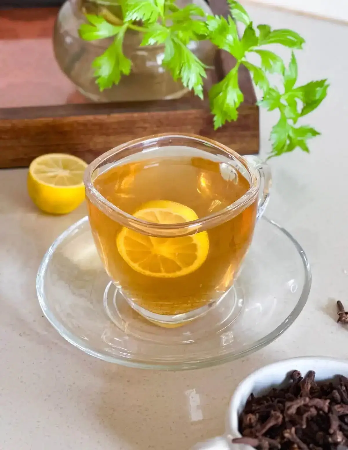 Clove Tea for Weight Loss 1 A cup of clove tea with cloves and spices for weight loss benefits