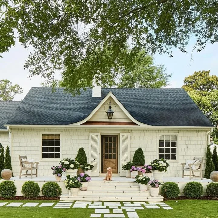 The True Definition of a Cottage 1 Cozy cottage surrounded by nature showcasing architectural charm